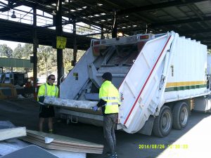 Truck picking up matresses